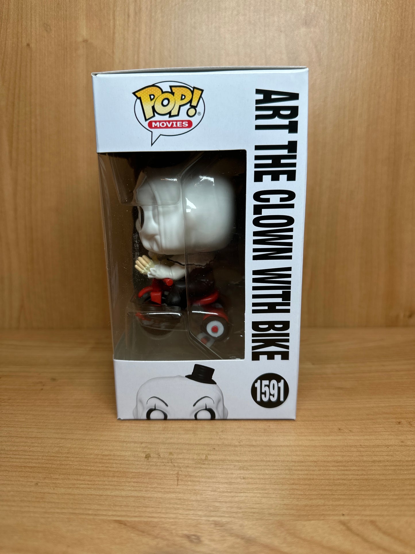 Funko Art the Clown from the terrifier on a bike